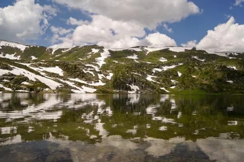 Small lake in mountain valley Stock Photos