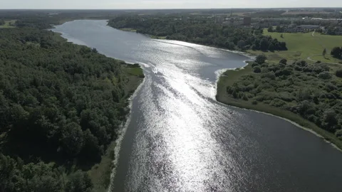 SMALL LAKE SMALL BOAT FAR - 3840x2160 - 59,94 FPS Stock Footage 168108899