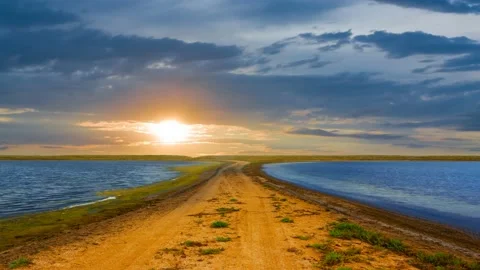 Small lakes in prairie at the dramatic sunset Stock Footage 238026640