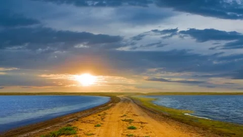 Small lakes in prairie at the dramatic sunset Stock Footage 324055457