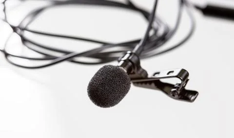 Small lavalier microphone or lapel mic with clip on white background. Stock-Fotos