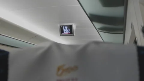 Small LCD TV screen at the top of a high-speed train compartment Stock Footage 148307252