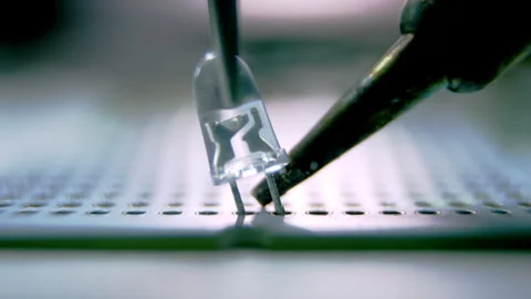 Small led bulb installed on panel with help of pincers Stock Footage 275485420