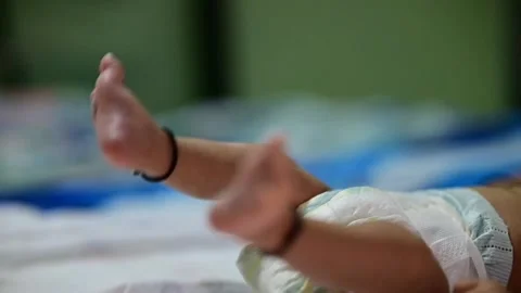 Small Legs of baby With Black Thread. Newborn Baby. Indian leg anklets. Stock Footage 220698801