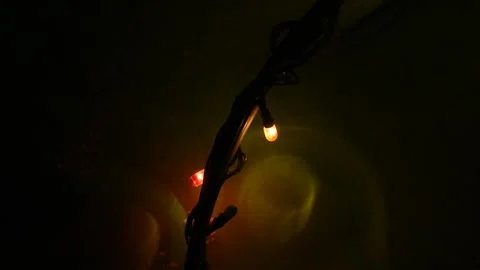 Small light blinking with low and high intensity in darkness Stock Footage 170393142