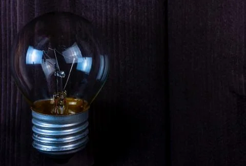 Small light bulb on background Stock Photos
