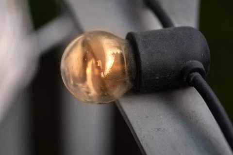 Small light bulb turned on Stock Photos