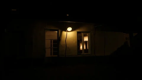 Small light at night over front door of cottage. France. Stock Footage 169391559
