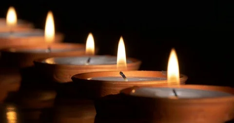 Small lighted candles in dark Stock-Footage 70376831