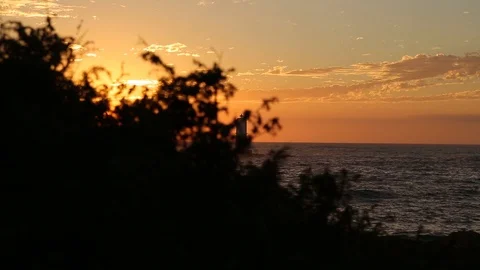 Small Lighthouse in the Ocean at Sunset in Sardinia Italy 2 Stock Footage 90242982