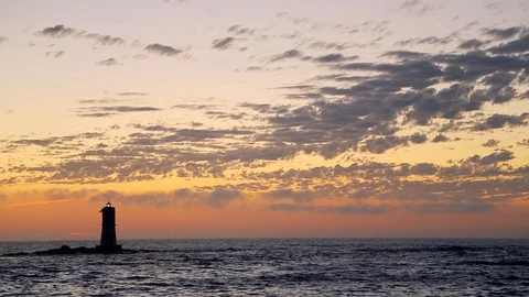 Small Lighthouse in the Ocean at Sunset in Sardinia Italy 1 Stock Footage 90242997