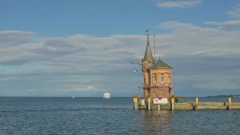 Small Lighthouse on old pier in harbor of Constance - Germany.  Stock Footage 317980594