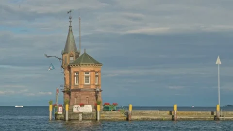 Small Lighthouse on old pier in harbor of Constance - Germany.  스톡 동영상 317980612