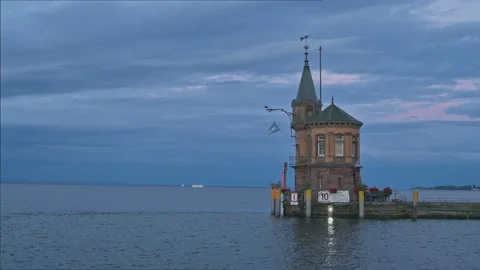 Small Lighthouse on old pier in harbor of Constance - Germany.  스톡 동영상 317980613