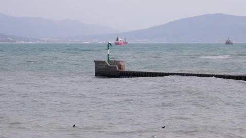 Small lighthouse in rough sea Stock Footage 234424912
