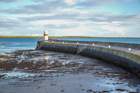 Small lighthouse in the seashore in the Isle of Man Stock Photos
