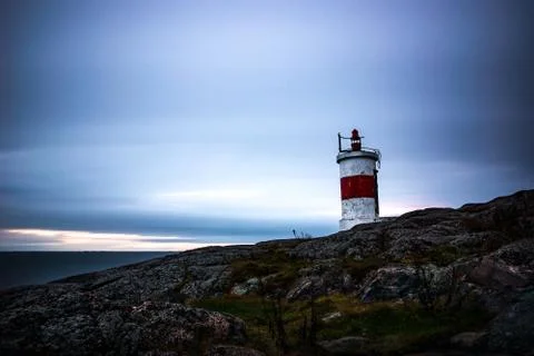 Small lighthouse in sunrise Stock Photos