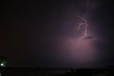 Small lightning strike in sky Stock Photos