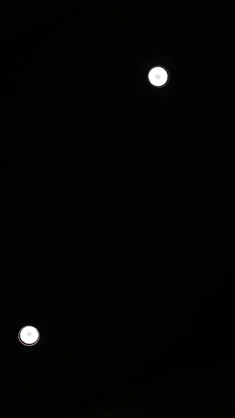 A small lights in the ceiling that illuminates a narrow hallway. Turn the Stock Footage 275357546