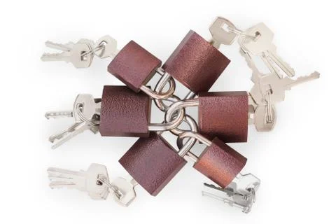 Small linked padlocks with keys isolated with clipping path Foto stock