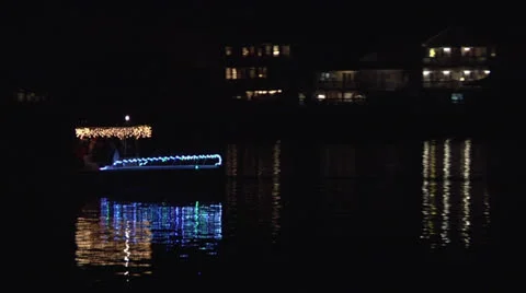 Small lit boat, track and hold Stock Footage 24453077