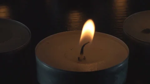 Small Lit Candle Macro Stock Footage 34470035