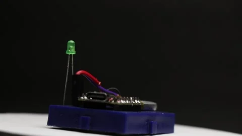 Small lithium polymer battery powering a microcontroller Stock Footage 336626407