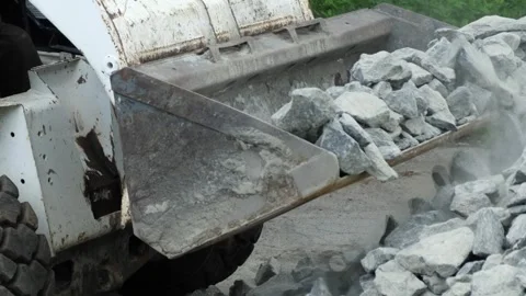 Small loader delivered and unloads crushed stone for gabion or construction work Stock Footage 311636830