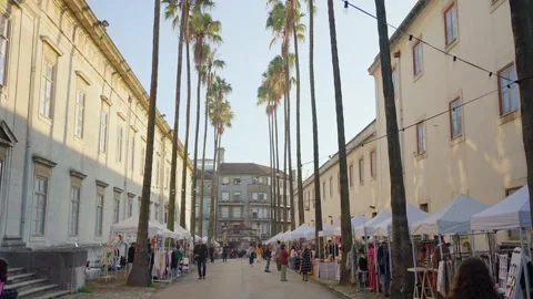Small local flea or pop up street market with tents and shops and customers Stock Footage 286852986