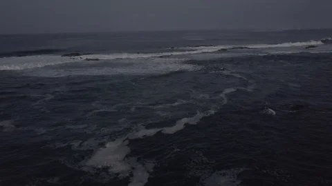 SMALL, LONG WAVES CRASH ROCKS | PART 03 OF 05 | EXT, AERIAL | 2398 | 4K Stock Footage 105256220