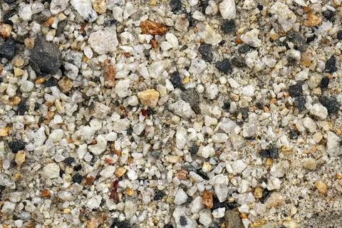 Small loose, different shape and size stones background. Textured, close up. Stock Photos