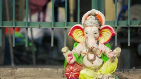 Small Lord Ganesh Idol Placed on Roadside for Worship Stock Footage 316893069