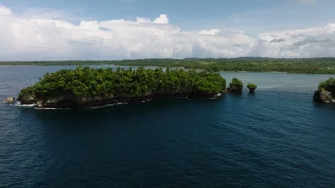 Small lush island surrounded by blue sea. Siargao, Philippines. Stock Footage 322512794