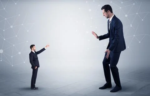 Small man aiming at a big man with network concept Stock Photos