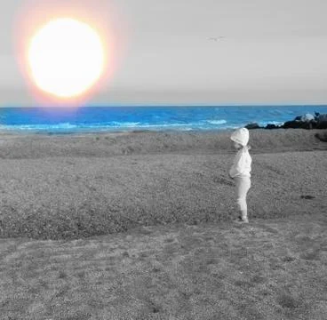 Small man on the background of a large celestial body 库存照片