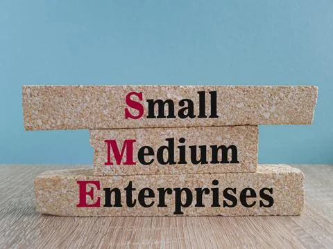 Small Medium Enterprise concept on brick blocks. Stock Photos
