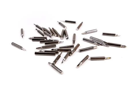 Small metal interchangeable screwdriver bits for a multitool Stock Photos