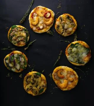 Small mini pizza. Set of different mini pizzas. Pizza: with shrimp, with mush Stock Photos