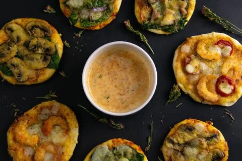 Small mini pizza. Set of different mini pizzas. Pizza: with shrimp, with mush Stock Photos