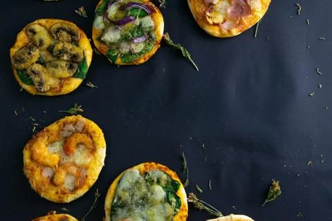 Small mini pizza. Set of different mini pizzas. Pizza: with shrimp, with mush Stock Photos