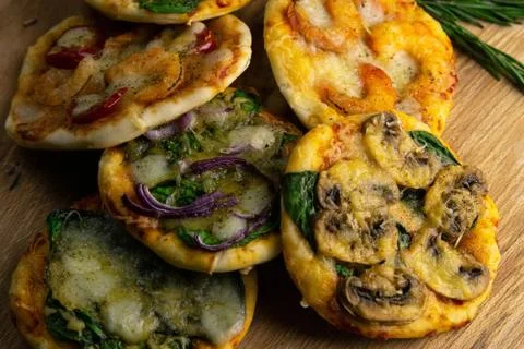 Small mini pizza. Set of different mini pizzas. Pizza: with shrimp, with mush Stock Photos