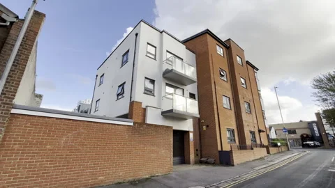 Small moddern block of flats in England Stock Footage 254123810