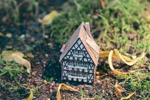 A small model of a half timber house on the ground Stock Photos