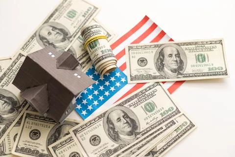 Small Model House on Layer of One Hundred Dollar Bills. Fotos Stock