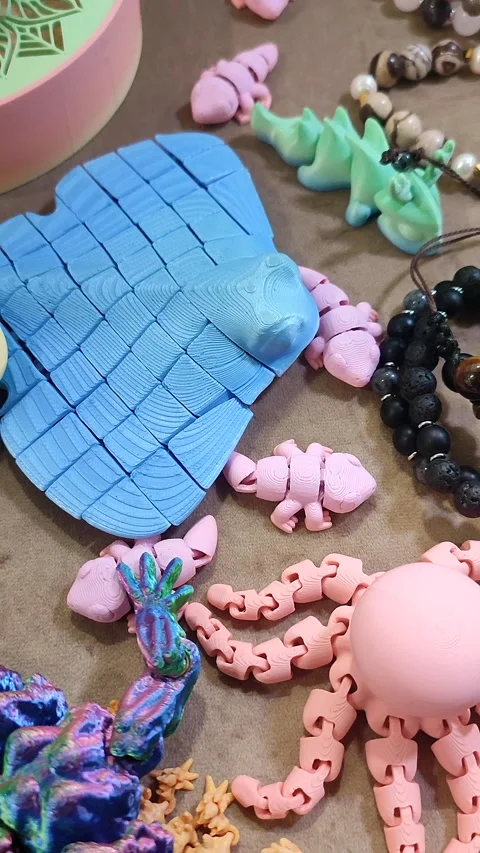 Small model of stingray printed 3D printer from molten colored plastic. Vertical Stock Footage 304074074