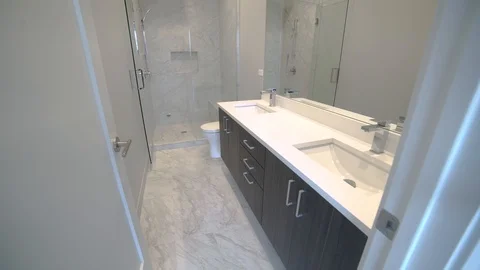 Small Modern Bathroom Lowering to Floor. shot lowers on a new modern bathroom Stock Footage 100995523