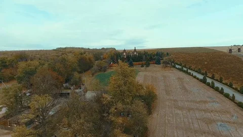 Small modern castle on a hill in the fall. Stock Footage 117910936