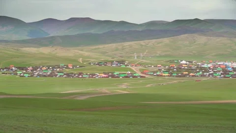 Small Mongolian town spreads across steppe meadow - Roof Detail and Prairie View Stock Footage 339472401