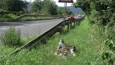 A small monument by the road, a memory of the dead of traffic accidents Stock Footage 158617379