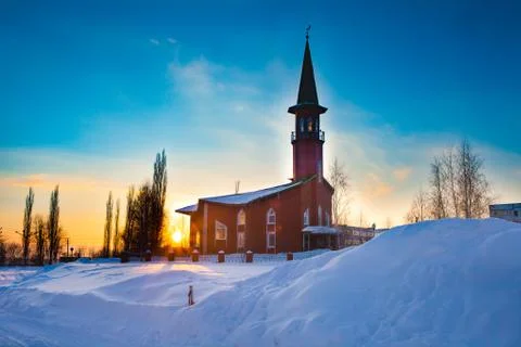 A small mosque of red brick. Winter. Sunset Stock Photos